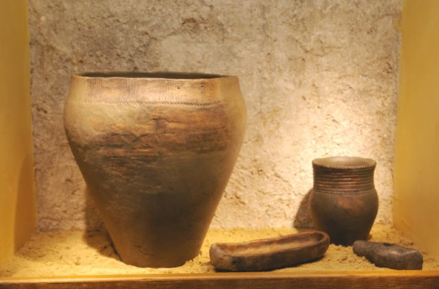 Ceramics of Baltic Coastal culture (Nida) and boat shaped battle axe. 3000-2000 BC. Photograph by A. Grušelionienė